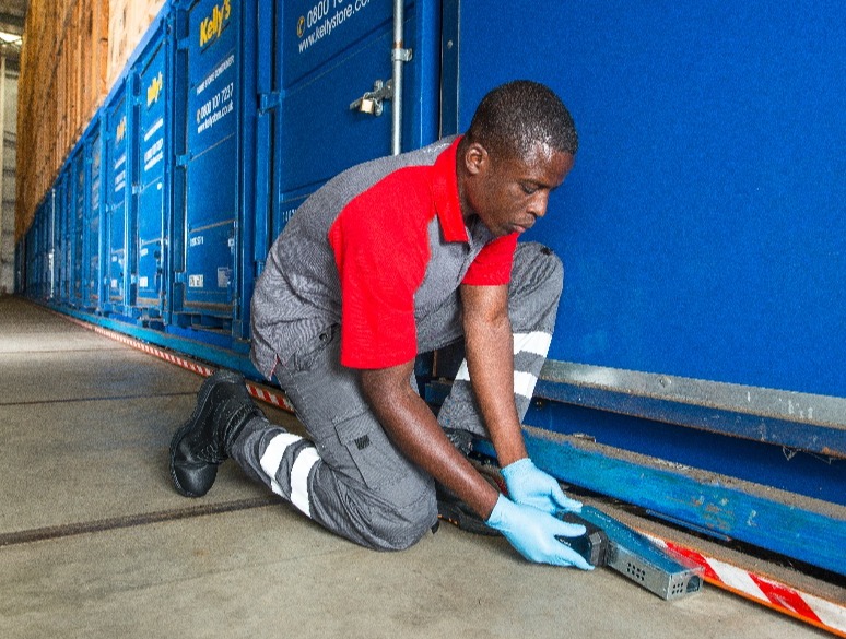 Rentokil_Female Technician with Product_little Pete_Warehouse2-1